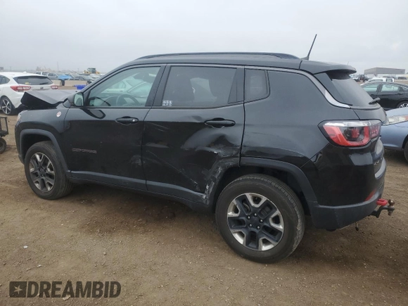 2018 Jeep Compass Trailhawk with VIN 3C4NJDDB6JT207289, listed as a Copart auction lot 56013675 with 83,385 mi miles and Salvage title. Bid and sale history available at DreamBid. Image 2.