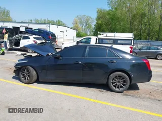 2014 Cadillac CTS Vsport RWD z VIN 1G6AU5S87E0176224, wystawiony jako IAAI lot #42273736 z przebiegiem Nie podano mil oraz . Historia ofert i sprzedaży dostępna na DreamBid. Obrazek 14.