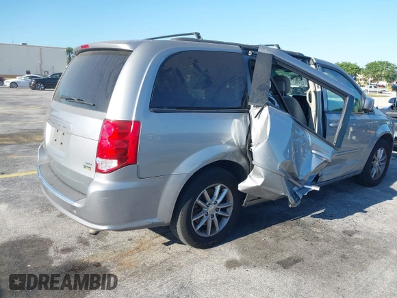 2015 Dodge Grand Caravan SXT with VIN 2C4RDGCG3FR592098, listed as a IAAI auction lot 42038665 with 104,092 mi miles and . Bid and sale history available at DreamBid. Image 4.