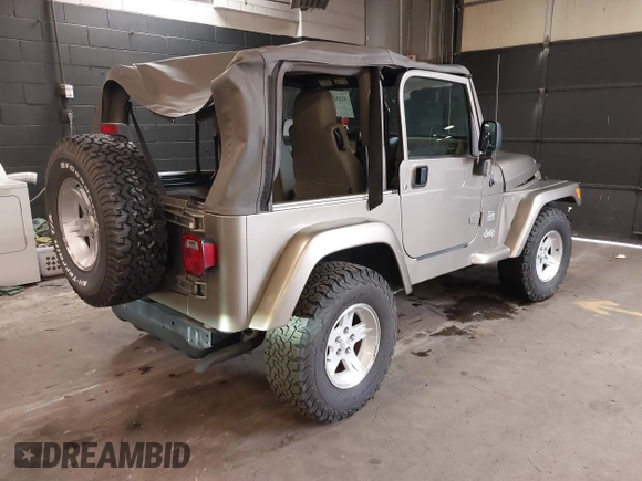 2004 Jeep Wrangler Sahara with VIN 1J4FA59S64P736389, listed as a IAAI auction lot 41432819 with 102,830 mi miles and . Bid and sale history available at DreamBid. Image 4.