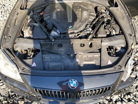 2014 BMW 6 Series 650i xDrive z VIN WBA6B4C54ED371520, wystawiony jako Copart lot #75107784 z przebiegiem 136 077 mil mil oraz Szkoda całkowita • Salvage title. Historia ofert i sprzedaży dostępna na DreamBid. Obrazek 11.