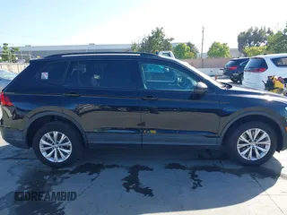 2018 Volkswagen Tiguan S with VIN 3VV1B7AX1JM091928, listed as a IAAI auction lot 42283454 with 53,650 mi miles and . Bid and sale history available at DreamBid. Image 13.