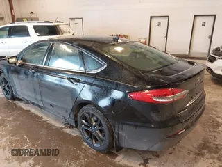 2019 Ford Fusion SE with VIN 3FA6P0HD3KR229021, listed as a IAAI auction lot 41576389 with 123,286 mi miles. Bid and sale history available at carsss.com. Image 3.