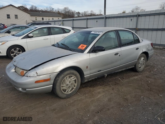 2002 Saturn SL with VIN 1G8ZF52812Z157082, listed as a Copart auction lot 77985264 with 0 mi miles and Salvage Title. Bid and sale history available at carsss.com. Image 1.