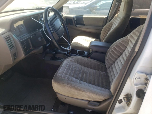 1994 Jeep Grand Cherokee Laredo with VIN 1J4GZ58Y7RC113333, listed as a Copart auction lot 57995734 with 220,950 mi miles and Clean Title. Bid and sale history available at carsss.com. Image 7.