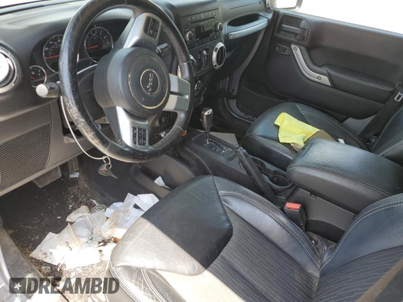 2013 Jeep Wrangler Unlimited Sport with VIN 1C4BJWDG4DL628518, listed as a Copart auction lot 65029795 with 142,852 mi miles and Salvage title. Bid and sale history available at DreamBid. Image 8.