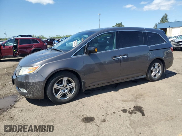 2012 Honda Odyssey Touring with VIN 5FNRL5H90CB093963, listed as a Copart auction lot 55434725 with 202,867 mi miles and Salvage Title. Bid and sale history available at DreamBid. Image 1.