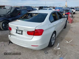 2014 BMW 3 Series 328i with VIN WBA3C1C59EK108868, listed as a IAAI auction lot 41108653 with Not Provided miles and . Bid and sale history available at carsss.com. Image 4.