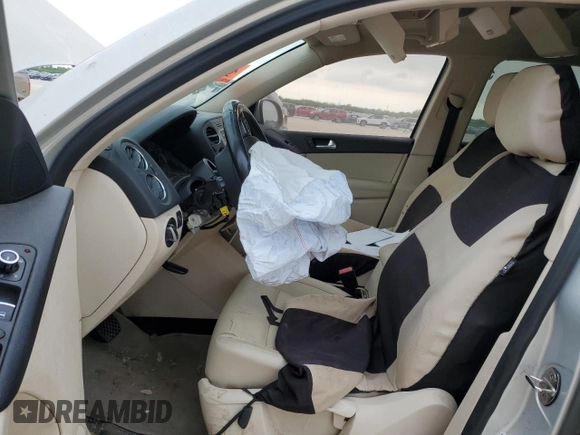 2012 Volkswagen Tiguan SEL with VIN WVGAV7AX2CW529098, listed as a Copart auction lot 53349565 with 128,603 mi miles and Salvage Title. Bid and sale history available at DreamBid. Image 7.
