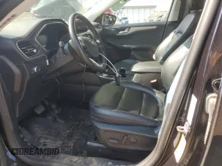 2021 Ford Escape SEL Hybrid z VIN 1FMCU9CZ7MUA94260, wystawiony jako Copart lot #71013514 z przebiegiem Nie podano mil oraz Szkoda całkowita • Salvage title. Historia ofert i sprzedaży dostępna na DreamBid. Obrazek 7.