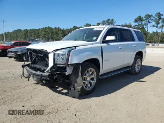 2016 GMC Yukon SLT with VIN 1GKS1BKC4GR138658, listed as a Copart auction lot 76634664 with 132,358 mi miles and Salvage Title. Bid and sale history available at carsss.com. Image 1.