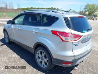 2016 Ford Escape Titanium with VIN 1FMCU9JX6GUB80715, listed as a IAAI auction lot 42060305 with 132,951 mi miles and . Bid and sale history available at DreamBid. Image 3.