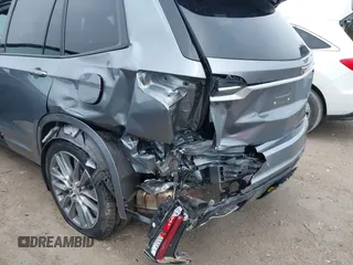 2021 Cadillac XT6 Sport with VIN 1GYKPGRS6MZ128112, listed as a IAAI auction lot 42415342 with 57,680 mi miles and . Bid and sale history available at DreamBid. Image 6.