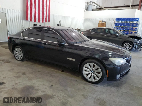 2011 BMW 7 Series with VIN WBAKX6C50BC197118, listed as a Copart auction lot 73686234 with 166,393 mi miles and Clean title. Bid and sale history available at DreamBid. Image 4.