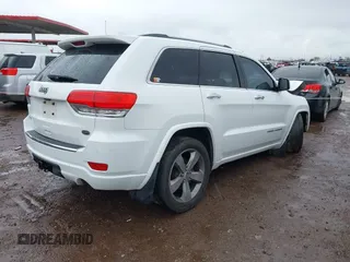 2014 Jeep Grand Cherokee Overland with VIN 1C4RJFCG9EC162098, listed as a IAAI auction lot 41746022 with 120,588 mi miles and . Bid and sale history available at DreamBid. Image 4.