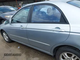 2004 Kia Spectra LX z VIN KNAFE121345017467, wystawiony jako IAAI lot #41911311 z przebiegiem 221 086 mil mil oraz . Historia ofert i sprzedaży dostępna na DreamBid. Obrazek 14.