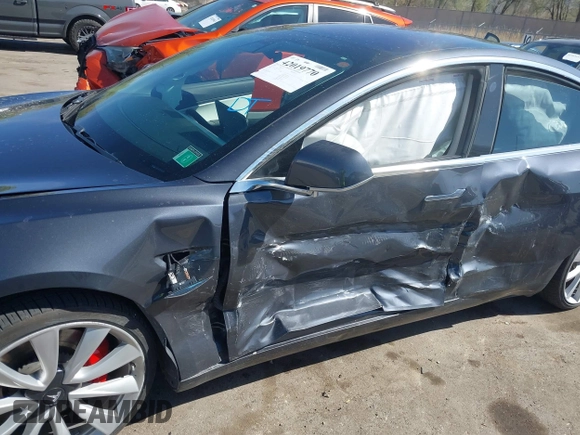 2018 Tesla Model 3 Long Range Battery with VIN 5YJ3E1EBXJF055203, listed as a IAAI auction lot 42019770 with 57,379 mi miles and . Bid and sale history available at DreamBid. Image 6.