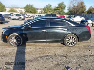 2013 Cadillac XTS z VIN 2G61N5S32D9238652, wystawiony jako IAAI lot #40966692 z przebiegiem 90 834 mil mil oraz . Historia ofert i sprzedaży dostępna na DreamBid. Obrazek 14.