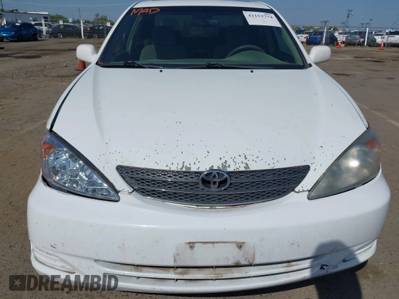 2002 Toyota Camry XLE z VIN 4T1BF32K22U032074, wystawiony jako IAAI lot #42153774 z przebiegiem 293 541 mil mil oraz . Historia ofert i sprzedaży dostępna na DreamBid. Obrazek 6.