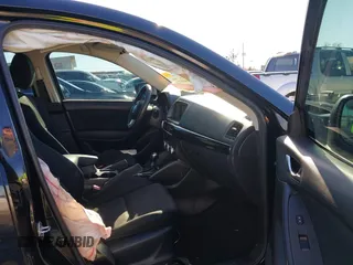 2016 Mazda CX-5 Sport with VIN JM3KE4BY0G0662294, listed as a IAAI auction lot 41469721 with 127,116 mi miles and . Bid and sale history available at carsss.com. Image 5.