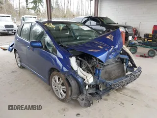 2009 Honda Fit Sport with VIN JHMGE88459C001743, listed as a IAAI auction lot 41852048 with 128,225 mi miles. Bid and sale history available at carsss.com. Image 1.