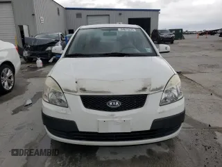2009 Kia Rio LX with VIN KNADE223X96439445, listed as a Copart auction lot 54619335 with 102,120 mi miles and Salvage Title. Bid and sale history available at DreamBid. Image 5.