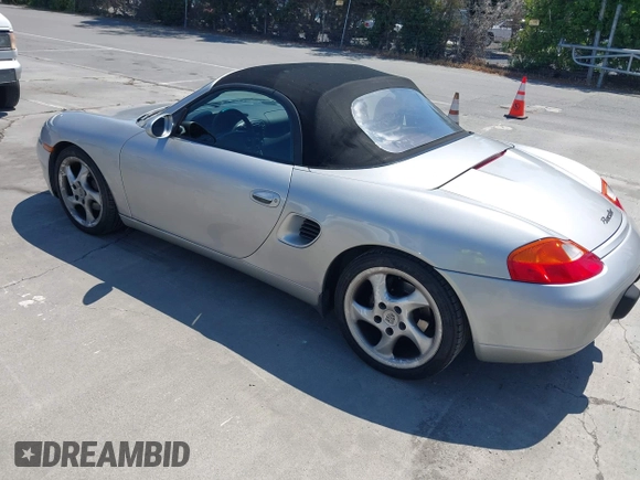 1999 Porsche Boxster with VIN WP0CA2984XU624983, listed as a IAAI auction lot 42722102 with 100,889 mi miles and . Bid and sale history available at DreamBid. Image 3.