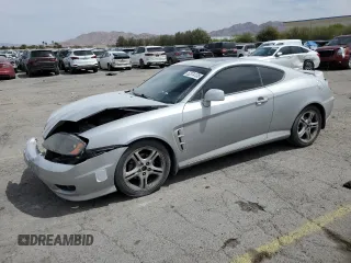 2006 Hyundai Tiburon GT z VIN KMHHN65F06U203701, wystawiony jako Copart lot #52374135 z przebiegiem 90 796 mil mil oraz Szkody całkowita. Historia ofert i sprzedaży dostępna na DreamBid. Obrazek 1.
