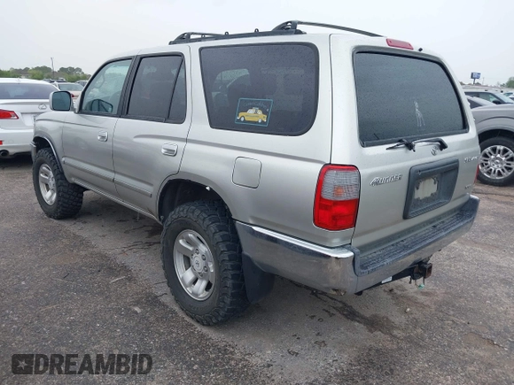 2000 Toyota 4Runner SR5 z VIN JT3HN86R1Y0301238, wystawiony jako IAAI lot #41896529 z przebiegiem 317 095 mil mil oraz . Historia ofert i sprzedaży dostępna na DreamBid. Obrazek 3.