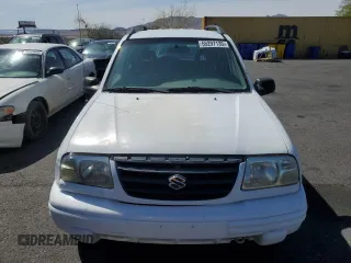 2003 Suzuki Vitara z VIN 2S3TE52V936103533, wystawiony jako Copart lot #55297135 z przebiegiem 122 230 mil mil oraz Szkody całkowita. Historia ofert i sprzedaży dostępna na DreamBid. Obrazek 5.