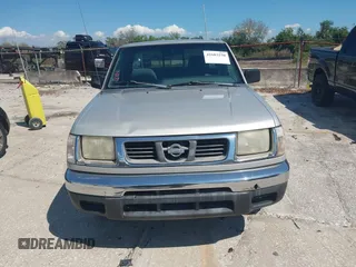 1999 Nissan Frontier XE z VIN 1N6DD26S4XC337030, wystawiony jako IAAI lot #41683250 z przebiegiem 143 765 mil mil oraz . Historia ofert i sprzedaży dostępna na DreamBid. Obrazek 6.