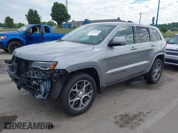 2018 Jeep Grand Cherokee Limited with VIN 1C4RJFBG7JC266715, listed as a IAAI auction lot 42562005 with 101,999 mi miles and . Bid and sale history available at DreamBid. Image 19.