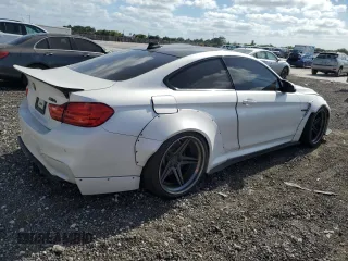 2015 BMW M4 with VIN WBS3R9C58FK330635, listed as a Copart auction lot 50525664 with 47,100 mi miles. Bid and sale history available at carsss.com. Image 3.