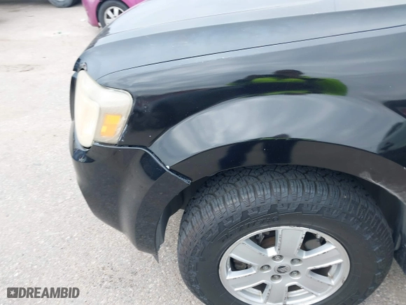 2010 Mercury Mariner with VIN 4M2CN8B75AKJ09335, listed as a IAAI auction lot 41279542 with 258,035 mi miles. Bid and sale history available at carsss.com. Image 6.