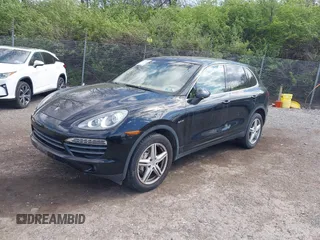 2011 Porsche Cayenne S Hybrid with VIN WP1AE2A27BLA91799, listed as a IAAI auction lot 42035613 with 131,480 mi miles. Bid and sale history available at carsss.com. Image 2.