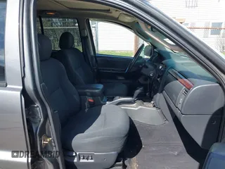 2003 Jeep Grand Cherokee Laredo with VIN 1J4GX48S53C504225, listed as a IAAI auction lot 41879669 with 247,246 mi miles. Bid and sale history available at carsss.com. Image 5.