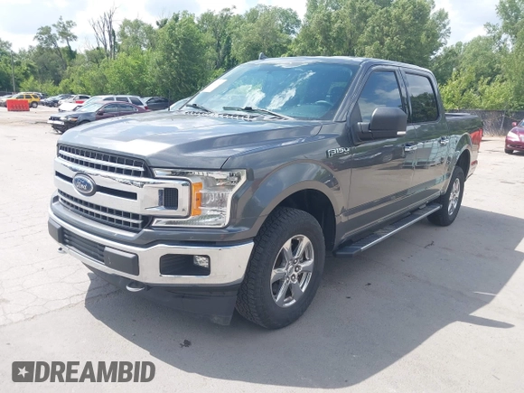 2018 Ford F-150 XL with VIN 1FTEW1E57JFA95086, listed as a IAAI auction lot 42574704 with 77,301 mi miles and . Bid and sale history available at DreamBid. Image 2.