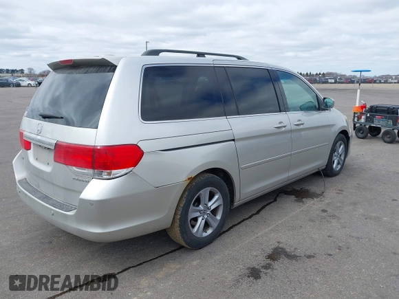 2008 Honda Odyssey Touring with VIN 5FNRL38928B109012, listed as a IAAI auction lot 41922712 with 241,589 mi miles. Bid and sale history available at carsss.com. Image 4.