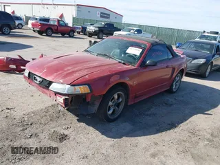 2001 Ford Mustang Deluxe with VIN 1FAFP44491F242798, listed as a IAAI auction lot 41779856 with 166,017 mi miles. Bid and sale history available at carsss.com. Image 2.