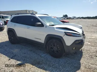 2015 Jeep Cherokee Trailhawk with VIN 1C4PJMBS0FW705288, listed as a Copart auction lot 61796275 with 133,874 mi miles and Salvage title. Bid and sale history available at DreamBid. Image 4.