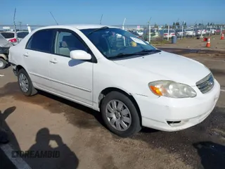 2004 Toyota Corolla CE with VIN JTDBR32E540051928, listed as a IAAI auction lot 41958483 with 299,999 mi miles. Bid and sale history available at carsss.com. Image 1.