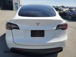 2023 Tesla Model Y Long Range z VIN 7SAYGDEE8PF816544, wystawiony jako Copart lot #57170485 z przebiegiem 74 598 mil mil oraz Szkoda całkowita • Salvage title. Historia ofert i sprzedaży dostępna na DreamBid. Obrazek 6.