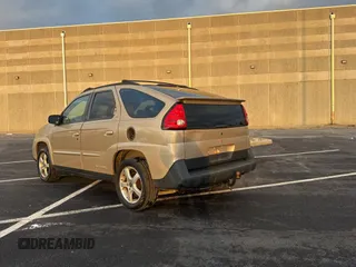 2002 Pontiac Aztek z VIN 3G7DB03E02S561022, wystawiony jako Copart lot #89014985 z przebiegiem 153 845 mil mil oraz Czysty tytuł • Clean title. Historia ofert i sprzedaży dostępna na DreamBid. Obrazek 3.
