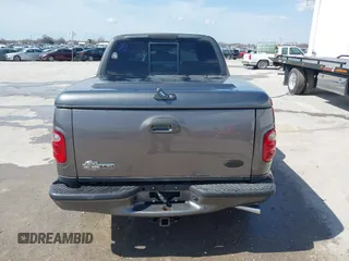 2002 Ford F-150 Harley Davidson with VIN 1FTRW07392KE11409, listed as a IAAI auction lot 41877998 with 148,476 mi miles. Bid and sale history available at carsss.com. Image 16.
