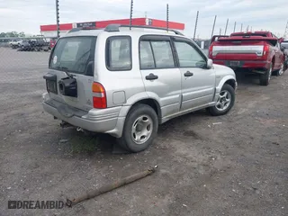 2000 Suzuki Grand Vitara JLX with VIN JS3TD62V5Y4117740, listed as a IAAI auction lot 42088696 with 166,484 mi miles. Bid and sale history available at carsss.com. Image 4.