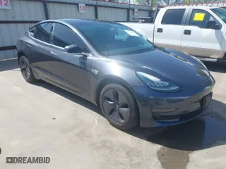 2018 Tesla Model 3 Long Range Battery with VIN 5YJ3E1EA4JF157782, listed as a IAAI auction lot 41774169 with 123,239 mi miles. Bid and sale history available at carsss.com. Image 1.