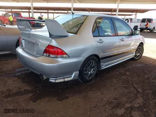 2005 Mitsubishi Lancer ES with VIN JA3AJ26E55U009131, listed as a IAAI auction lot 41980014 with 227,805 mi miles. Bid and sale history available at carsss.com. Image 4.