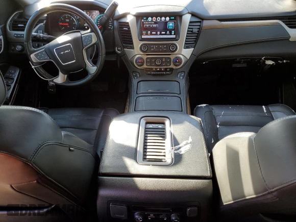 2018 GMC Yukon Denali with VIN 1GKS2CKJ3JR404177, listed as a Copart auction lot 82577354 with 129,744 mi miles and Salvage Title. Bid and sale history available at carsss.com. Image 8.