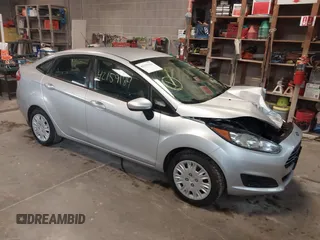 2017 Ford Fiesta S z VIN 3FADP4AJ8HM159469, wystawiony jako IAAI lot #42159184 z przebiegiem 99 466 mil mil oraz . Historia ofert i sprzedaży dostępna na DreamBid. Obrazek 1.