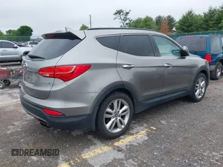 2014 Hyundai Santa Fe z VIN 5XYZW3LA2EG217854, wystawiony jako IAAI lot #42318822 z przebiegiem 120 234 mil mil oraz . Historia ofert i sprzedaży dostępna na DreamBid. Obrazek 4.